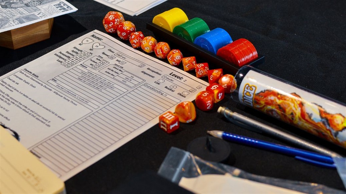 Close up of sheet dice and colored coins for RPG gaming weekend