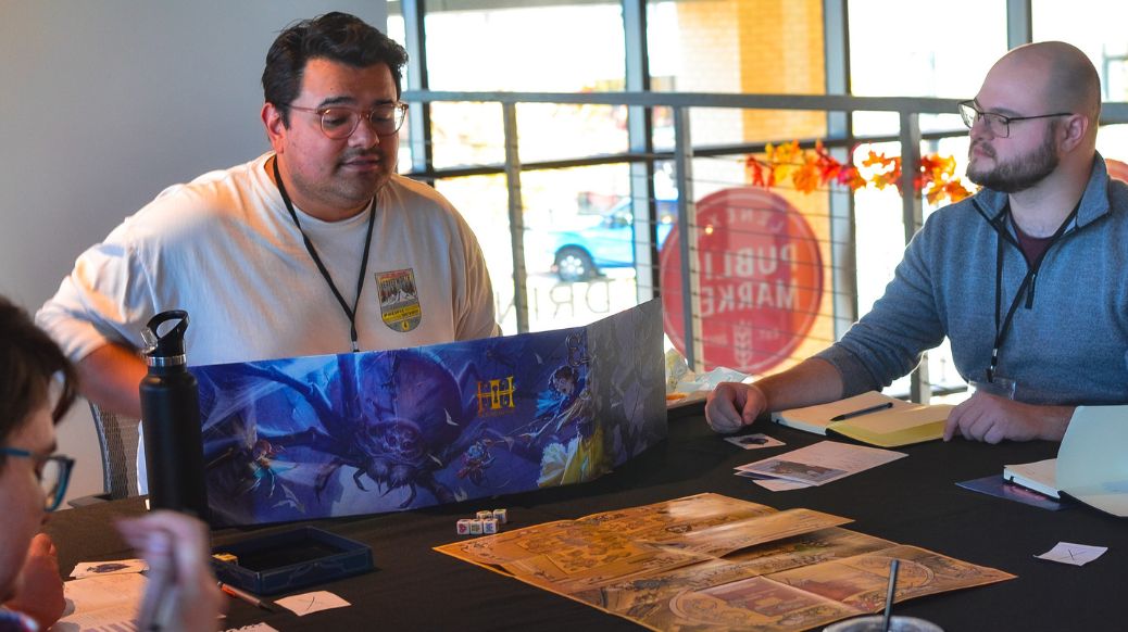 Group focused on game in center of table