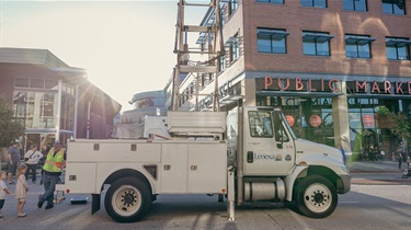 Municipal services vehicle with Public Market in the background