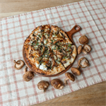 Crispy kale and fresh mushroom pizza with ricotta cheese made by Topp'd Pizza + Salads