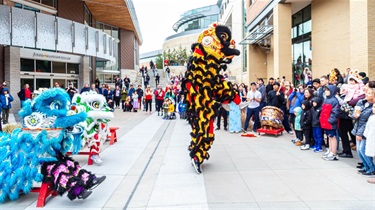 Lion dance performers outside of the Lenexa Public Market