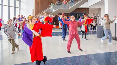 Attendees doing a dance workshop inside Lenexa City Hall