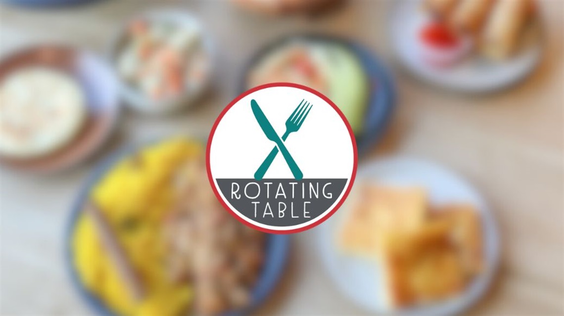 Rotating table main image with blurred food in background and logo on top