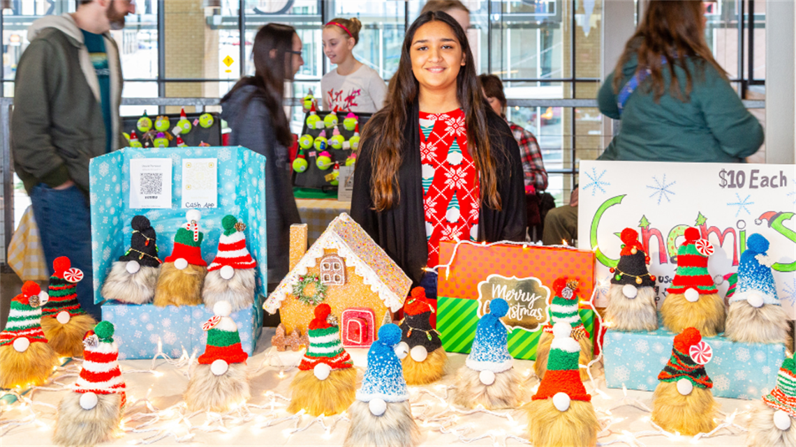 Kid maker selling holiday-themed gnomes at the Holiday Kid Makers Market