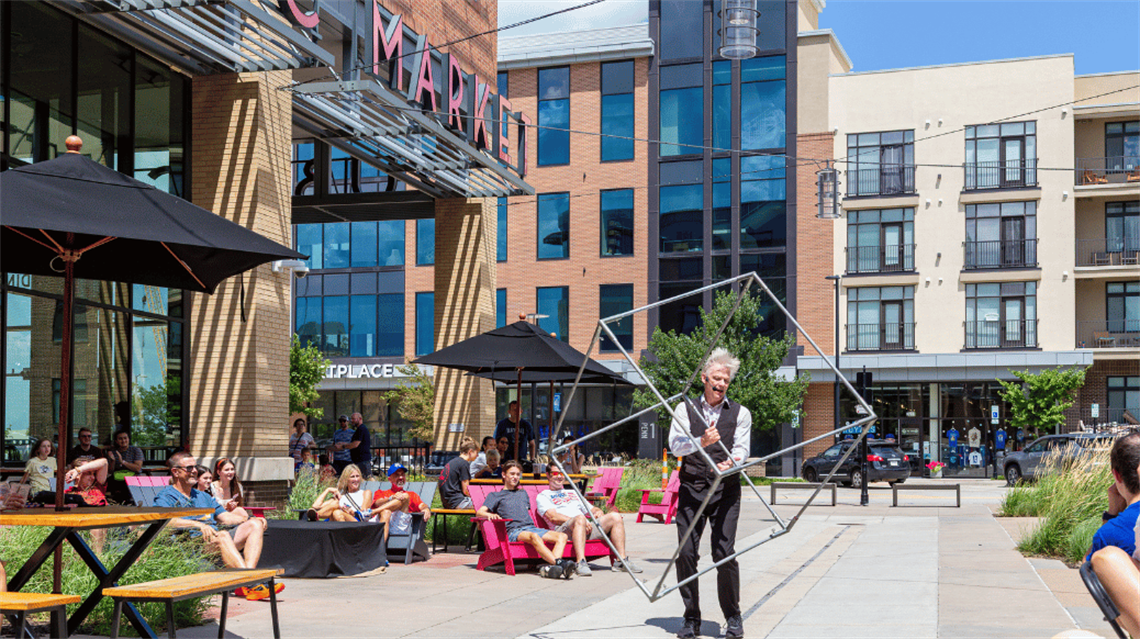 Live juggling performance outside the Lenexa Public Market