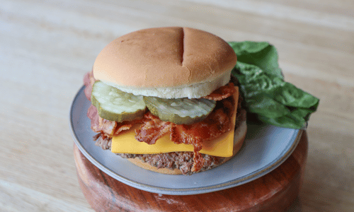 Cheeseburger on wooden stand