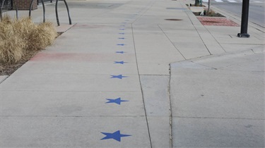 Blue stars on ground outside the Public Market