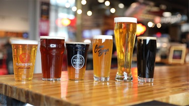 Line of beer in glasses inside the Public Market